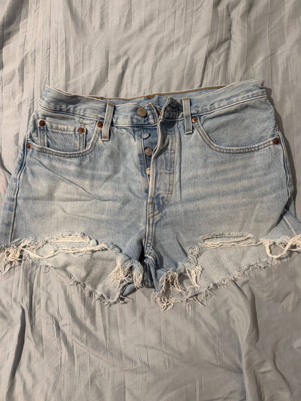 501 Levi's Light Blue Distressed High-Rise Jean Shorts